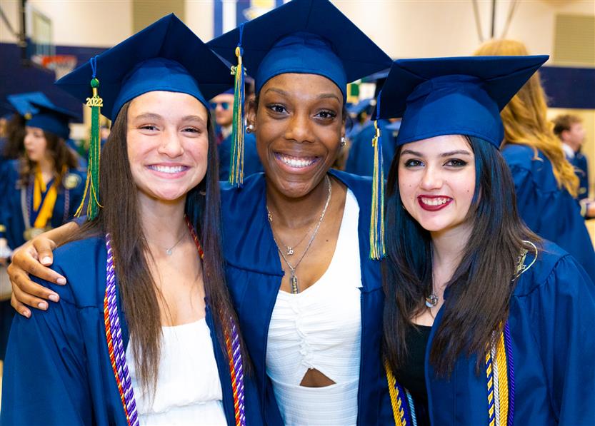 Students wearing blue graduation robes